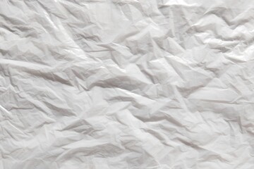 Obraz premium ​Crumpled white plastic texture background, wrinkled synthetic film surface