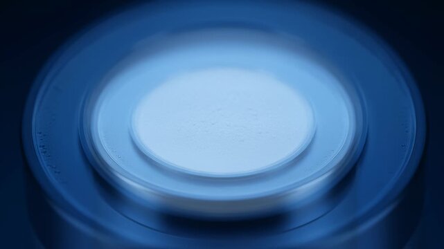 Close Up of Blue-Lit Circular Device With Inner Circle, Macro