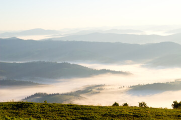 sunrise over foggy mountains, morning on the top of Carpathian.