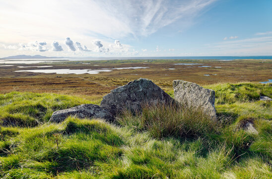 South Clettraval Chambered Cairn prehistoric tomb on S slope of South Clettraval, North Uist. S from chamber slabs to Beinn Mhor on horizon, S. Uist