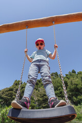 Girl playing on the swing