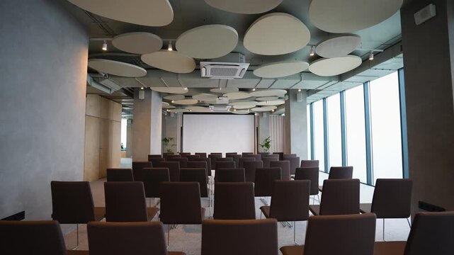 Empty modern conference room with projector screen