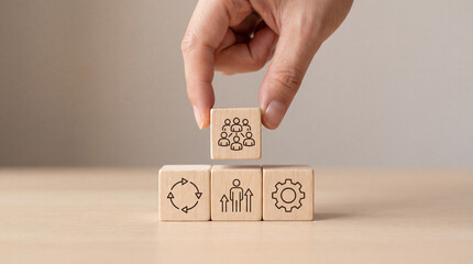 Teamwork and Collaboration Concept: Hand Stacking Wooden Blocks with Icons