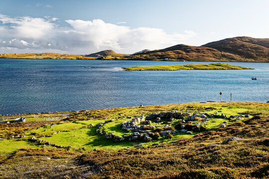 Allt Chrisal multi period prehistoric site on S. shore of Barra, Outer Hebrides. View S over Iron Age wheelhouse to Vatersay