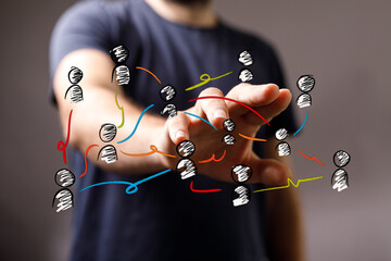 Close up of a man hand touching a network of connected people, concept of teamwork, connection and...