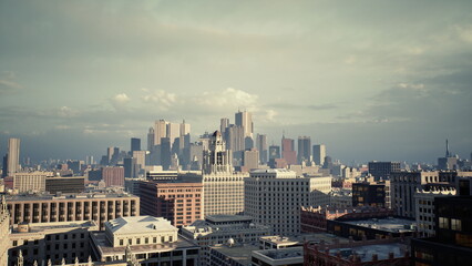 Fototapeta premium urban skyline at dusk soft light vintage cinematic tones distant skyscrapers over brick rooftops rooftop photographer urban planner surveying delivery truck