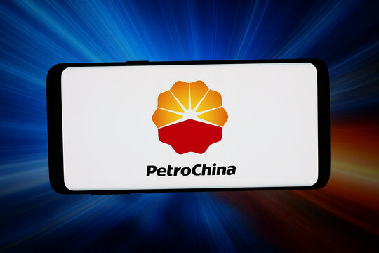 Stuttgart, Germany - 02-23-2026: In this photo illustration, the logo of energy company PetroChina Company Limited is displayed on a smartphone in front of abstract background on computer screen.