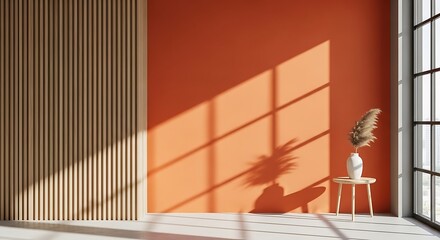 Obraz premium sunlight on orange wall with vase and shadow.