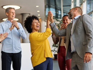 Portrait of a businesswoman celebrating during a meeting in office, group of businesspeople...