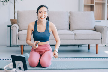 Young Asian sporty attractive people practicing yoga lesson with instructor. Asia group of women exercising healthy lifestyle in fitness studio. Sport activity, gymnastics or ballet dancing class.