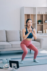 Young Asian sporty attractive people practicing yoga lesson with instructor. Asia group of women exercising healthy lifestyle in fitness studio. Sport activity, gymnastics or ballet dancing class.