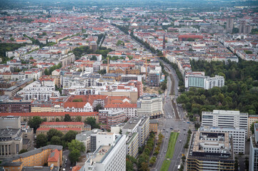 Obraz premium Berlin, germany, august 15, 2023. Sprawling berlin cityscape from a high vantage point, revealing diverse urban architecture, streets, green areas, and rooftops