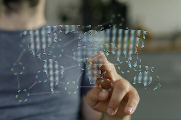Person interacting with a digital world map concept, symbolizing global networking, future...