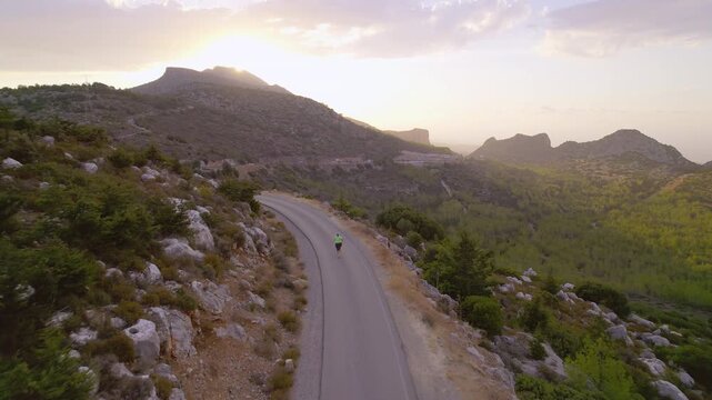 Obese Woman Running in Scenic Outdoor Environment at Sunset Working on Fitness and Weight Loss, drone view