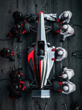 Top down view silver and red formula race car in pit lane. Concept of high performance race management, motorsport branding visuals, team coordination under pressure.