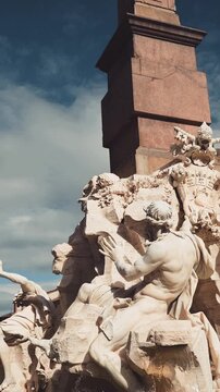 Slow motion detail of the fountain of the Four Rivers, a masterpiece by Gian Lorenzo Bernini in Piazza Navona, a famous baroque landmark and UNESCO World Heritage site in Rome, Italy