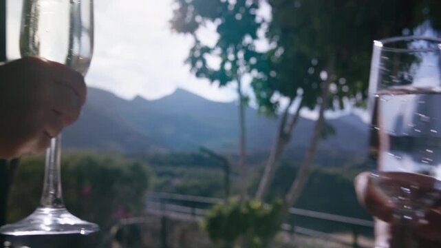 Two Glasses of Sparkling Wine Toasting Together with Breathtaking Mountain View