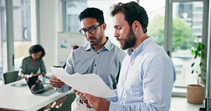 Business, men and meeting with document in office for discussion, planning and finance report. Team, people and talk with paperwork of budget review, financial audit and contract for funding proposal