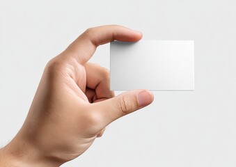 Obraz premium A hand holds a blank rectangular card, offering it to the viewer, against a white background