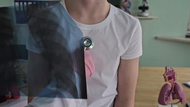 Doctor examines chest X-ray of patient during consultation in medical office