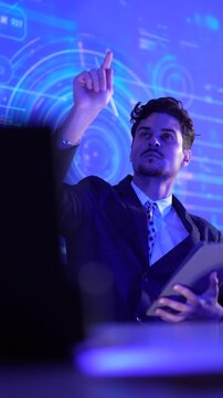 Chief Technology Officer monitoring global telecommunications infrastructure on digital tablet. Male executive analyzing international network operations center data against futuristic globe visualiza