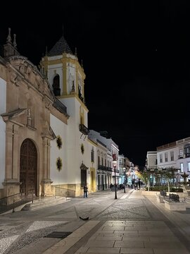 Illuminated historic Plaza del Soccoro square and church at night in the old town Ronda, Andalusia, Spain, February 2025