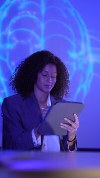 Computational neuroscientist analyzing digital brain connectome data via tablet interface. AI researcher monitoring neural network synaptic simulation metrics.