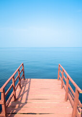 Obraz premium Red Aesthetic Ramp Over Serene Kerala Backwaters