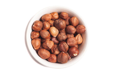 Obraz premium hazelnuts in bowl isolated on white, top view