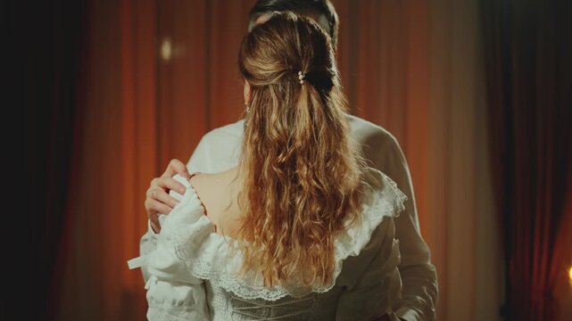 Two person fall in love, happy couple together man king touching hand sexy noble woman queen white dress. dark room. Adult girl bride guy groom old style back rear view, medieval ball wedding party 4k