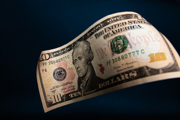 Floating 10 US Dollar Bill with Alexander Hamilton on Black Background