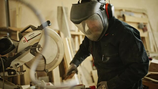 Carpenter Cutting Wood with Circular Saw in Workshop 4K
