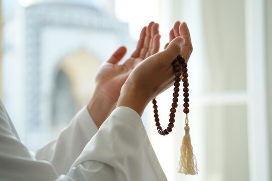 Muslim man praying in Islam Mosque with beads, AI generated image