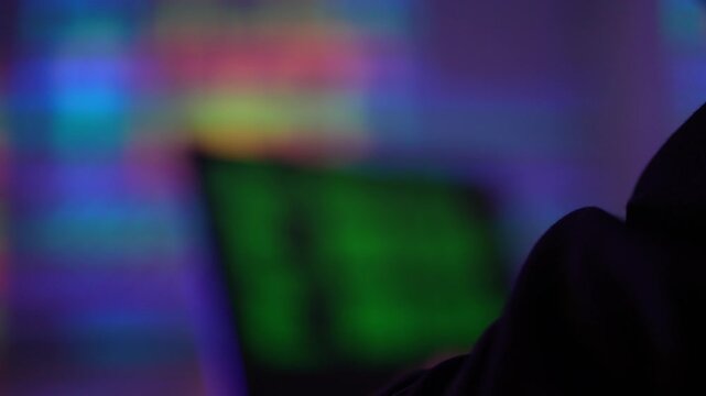 Backend software engineer writing complex command line scripts in dark office. Lead DevOps programmer debugging server infrastructure code late at night.