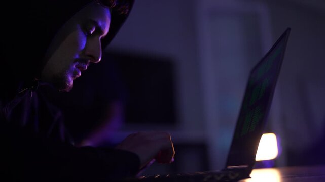 Backend software engineer writing complex command line scripts in dark office. Lead DevOps programmer debugging server infrastructure code late at night.