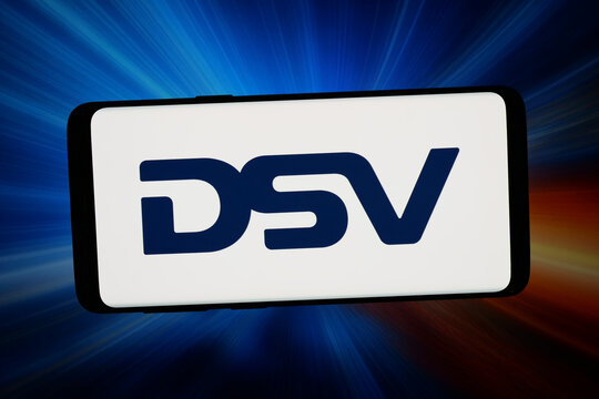Stuttgart, Germany - 02-23-2026: In this photo illustration, the logo of Danish transport and logistics company DSV AS is displayed on a smartphone in front of abstract background on computer screen.