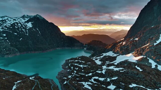 Aerial view of a serene mountain lake at sunset