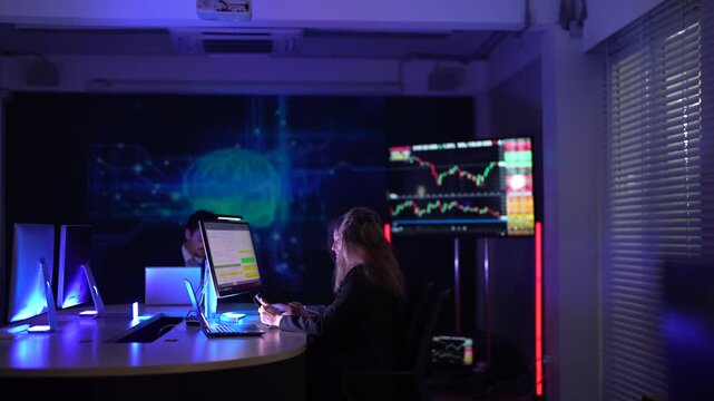 Female fintech data scientists analyzing real-time cryptocurrency market volatility charts. Quantitative analysts developing high-frequency algorithmic trading strategies on multi-screen dashboard set