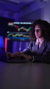 Senior software developers debugging complex backend cloud infrastructure code. Female data science engineers reviewing predictive AI algorithms on digital tablet and monitor.
