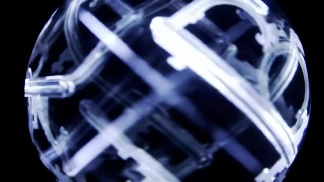 Illuminated skeleton keys rotate in an abstract sphere