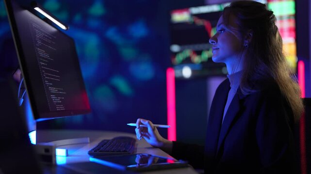 Cybersecurity analyst monitoring real-time network threat logs in dark security operations center. Digital forensic expert auditing malware code syntax via tablet interface.