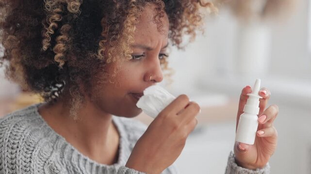 African American woman sick. medicine nasal spray with aerosol for colds, asthma pump to improve well-being. health problems, aerosol medications respiratory remedies for coughs, illnesses, allergies.