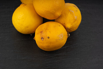 Old dried lemons. Fruits with darkened skins