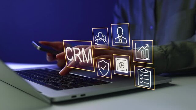 Using CRM software on a laptop for business management during a digital meeting.