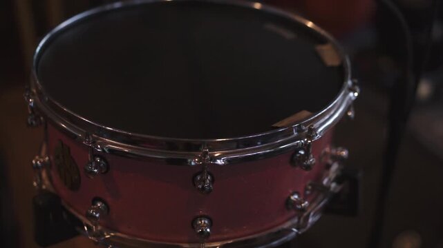 Close-up drummer playing drum in music concert or performance