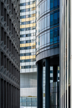Modern corporate skyscraper facade abstract composition with glass columns and shadows in Paris La Defense business skyline architecture