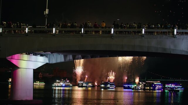Night Festival with Bright Fireworks Over City