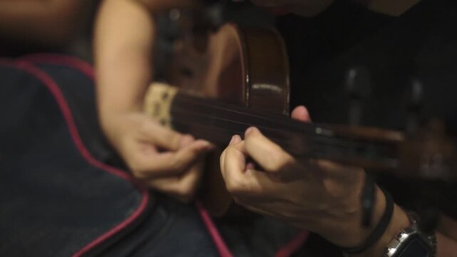 Female Violinist Playing in Dramatic Studio Lighting