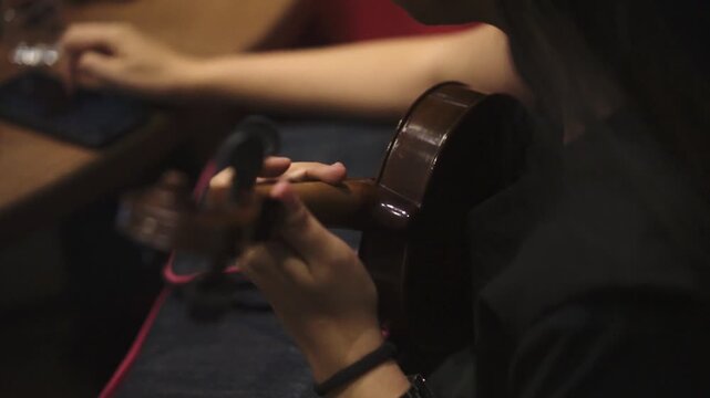 Female Violinist Playing in Dramatic Studio Lighting