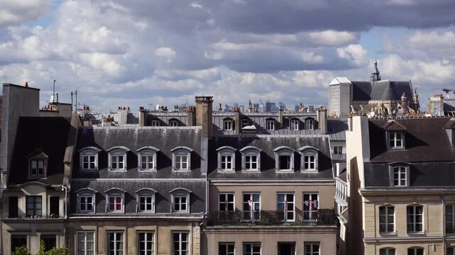 Square of Georges Pompidou and cityscape of Paris towards Montmartre with moving sunshine and clouds, France